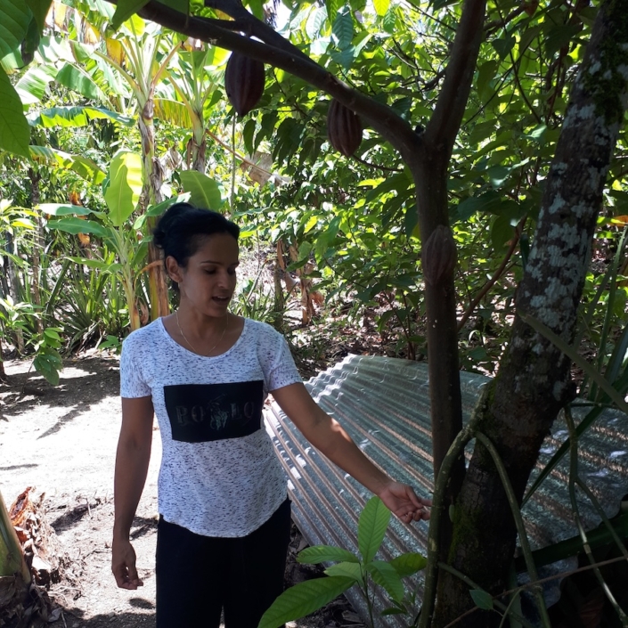 Lisbet beside a cacao tree