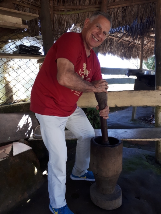 Me grinding coffee with a pilon